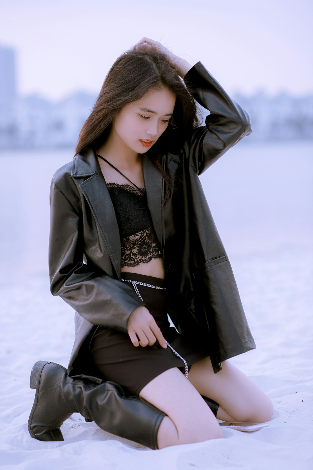 services-04 a-woman-sitting-on-the-ground-in-a-skirt-and-jacket-ewwwqvhoxlc